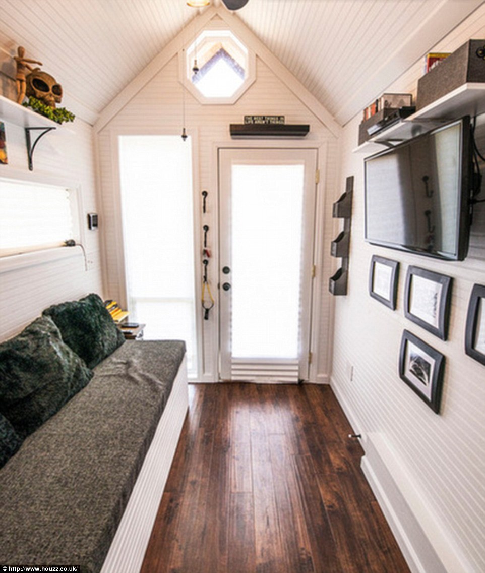 'Light colors and window placement are very important as well as the high ceiling when you walk in,' explains the designer from Tennessee-based Tiny Happy Homes, which creates custom-made homes