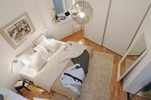 Designed bedrooms in a Scandinavian style view from above large bed and mirror