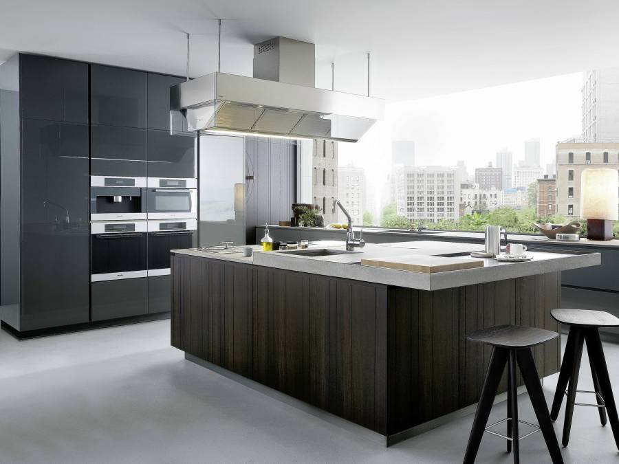 Contemporary kitchen with dark wood cabinets and white marble counters