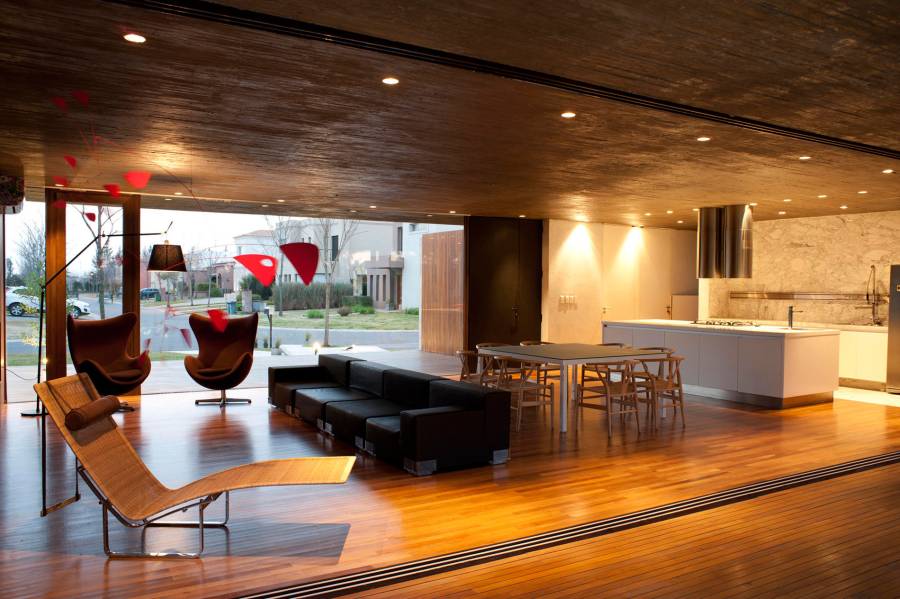 Contemporary kitchen with hardwood floors open to dining room