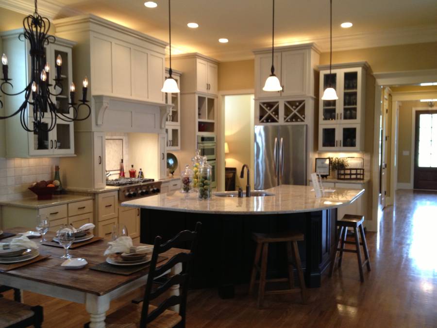 Contemporary kitchen with hardwood floors open to dining room