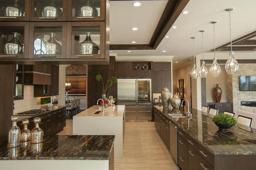 Contemporary kitchen with high ceilings light wood floors and dark cabinets