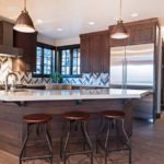 Contemporary kitchen with sink built in island