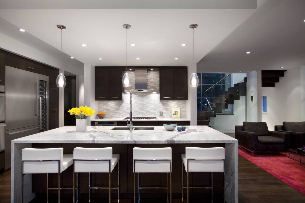 contemporary kitchen with limestone and rich wood cabinetry