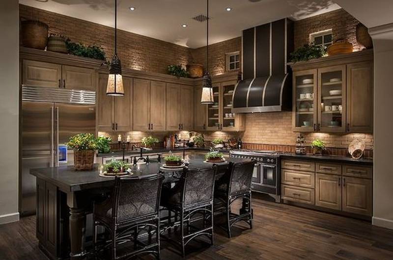 contemporary kitchen with limestone and rich wood cabinetry