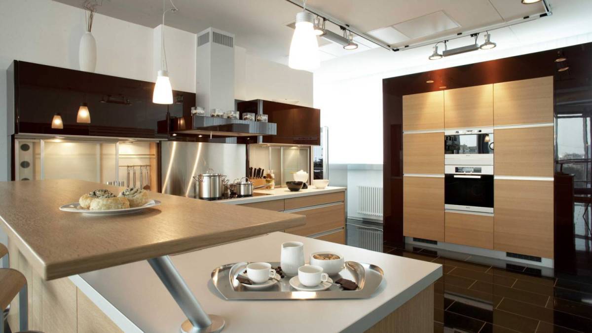 contemporary kitchen with limestone and rich wood cabinetry