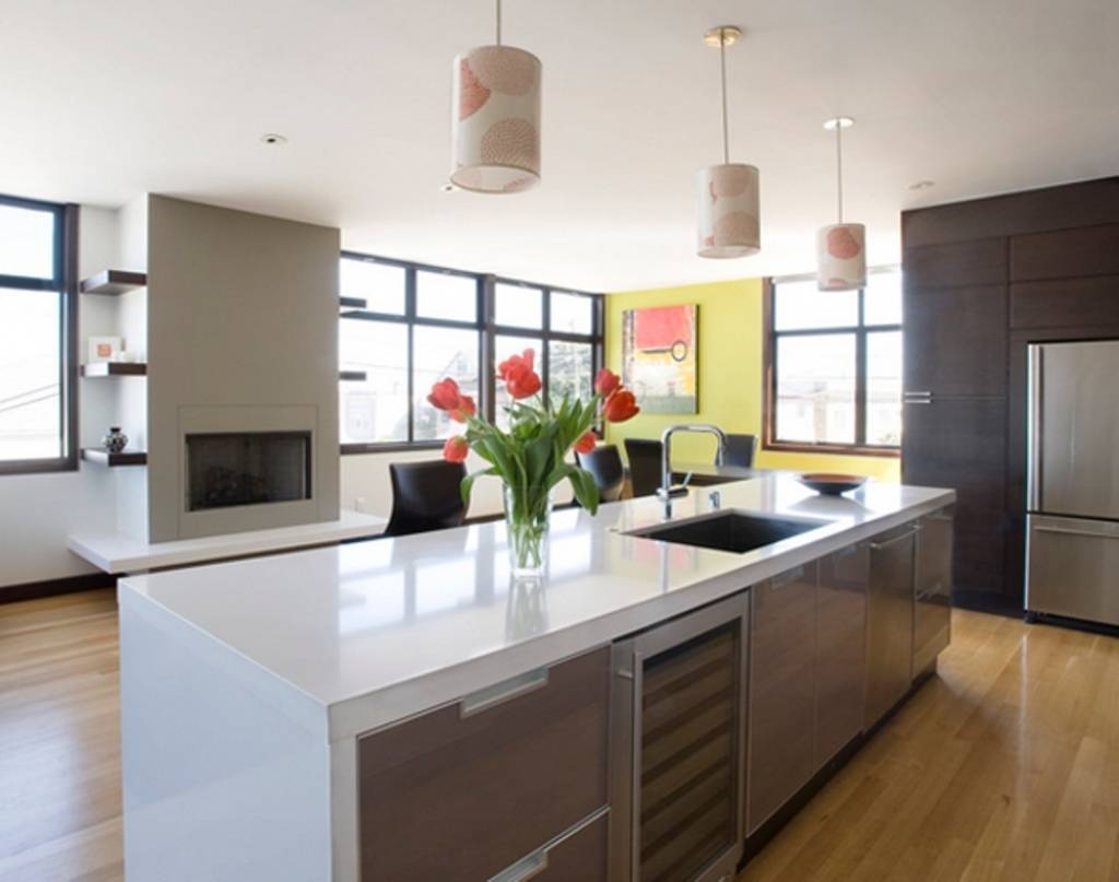 contemporary kitchen with limestone and rich wood cabinetry