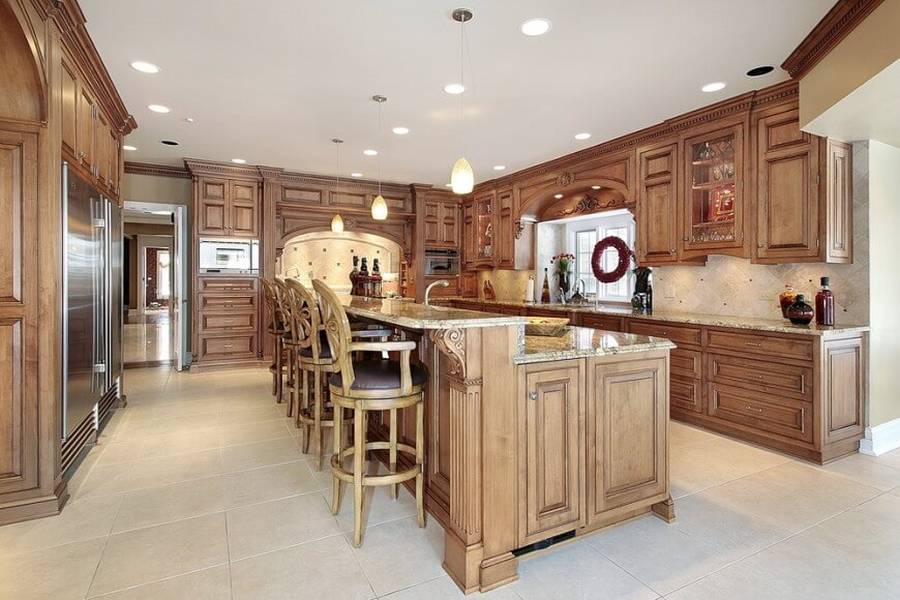 Designer custom kitchen with concrete counter island with dining nook