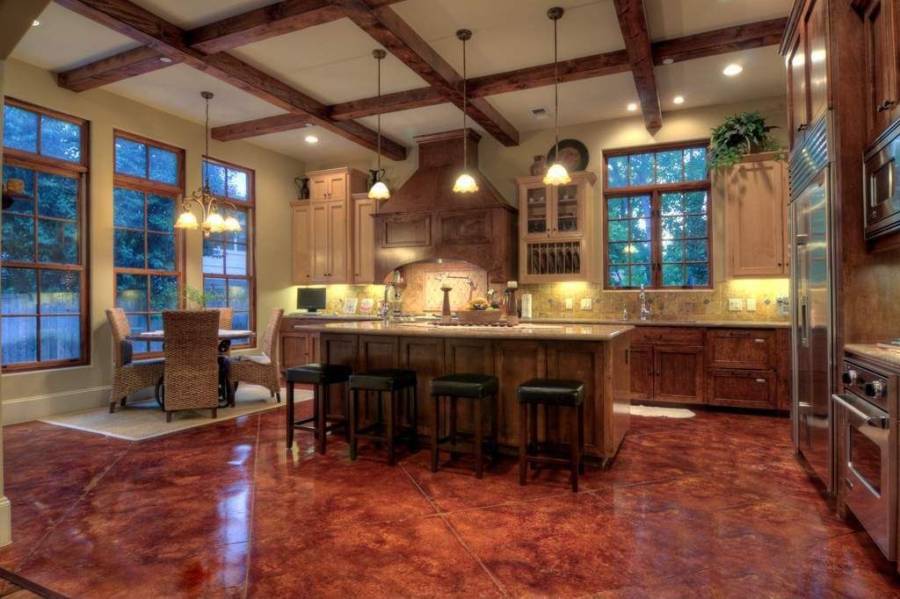 Designer custom kitchen with concrete counter island with dining nook