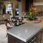 Designer custom kitchen with concrete counter island with dining nook