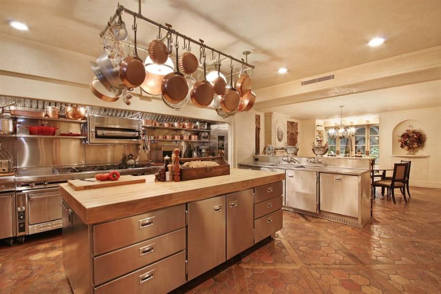 Designer custom kitchen with concrete counter island with dining nook