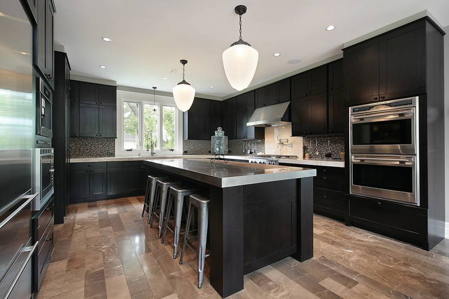 Designer custom kitchen with concrete counter island with dining nook