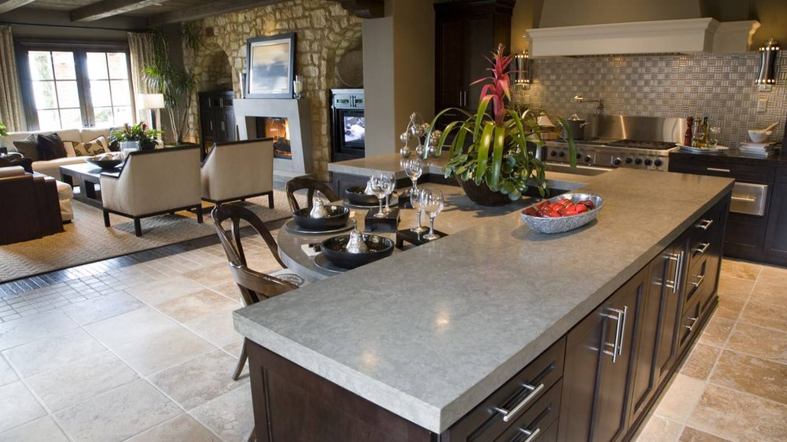 Designer custom kitchen with concrete counter island with dining nook