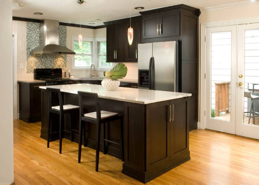 White quartz counter kitchen with dark wood