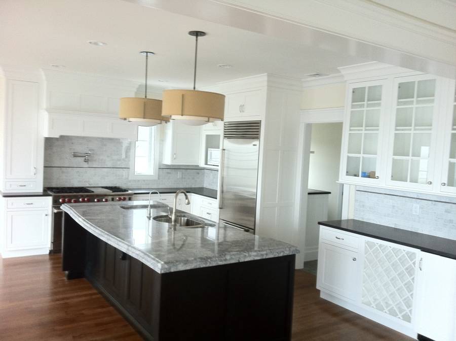 White quartz counter kitchen with dark wood