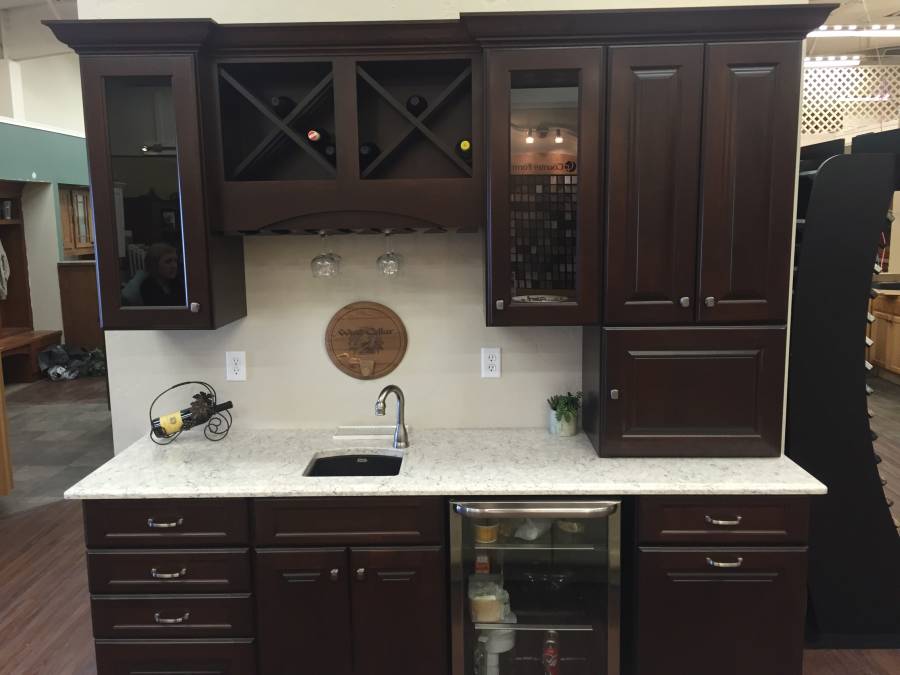 White quartz counter kitchen with dark wood