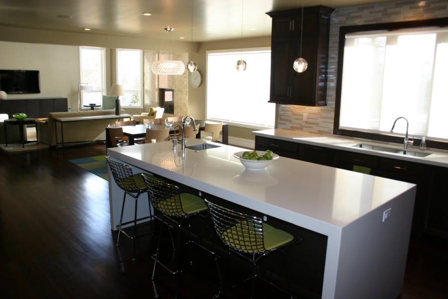 White quartz counter kitchen with dark wood