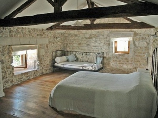 ground stone walls wooden double-bed view