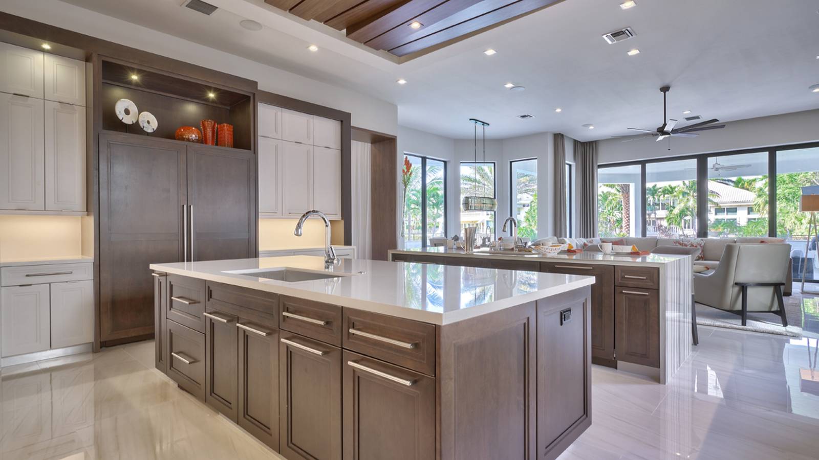 contemporary kitchen with limestone and rich wood cabinetry