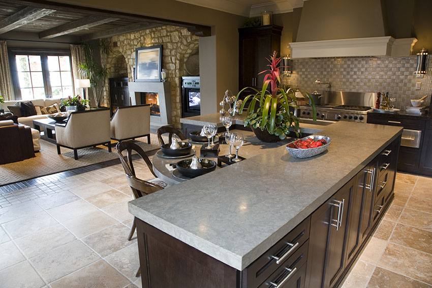 Designer custom kitchen with concrete counter island with dining nook